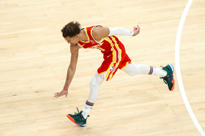 Atlanta Hawks guard Trae Young (11) celebrates a basket against the New York Knicks in the fourth quarter during game three in the first round of the 2021 NBA Playoffs at State Farm Arena.